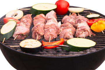 raw chopped pork neck meat with vegetables on the grill, white background