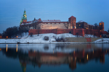 View of the Wawel castle and the Vistula River in Krakow in winter night