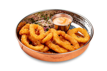 Onion rings fried in breading with cheese sauce