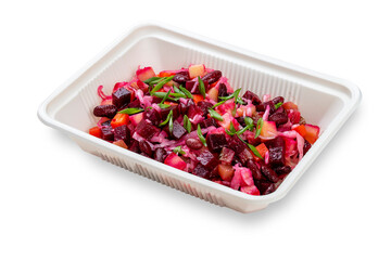 Vinegret or vinaigrette Russian red salad with cooked and pickled vegetables, peas, beetroot. In a plastic container. Food to go. On a light background.