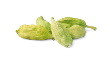 Pile of dry green cardamom on white background