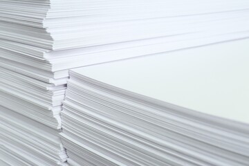 Stacks of white paper sheets, closeup view