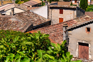 Picturesque rooftops of typical houses in old town Vallon-Pont-d’Arc in Provence. Architecture of...