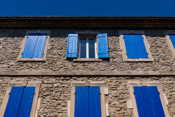 Facade of an old house in Vallon-Pont-d'Arc in Provence. Typical architecture of southern France on...