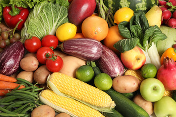 Assortment of fresh organic fruits and vegetables as background, top view