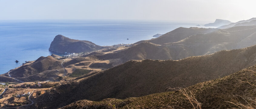 Lentas, south coast of Crete, Greece. Hypnotic landscape &ndash; small seaside village in evening dusk among Asterousia mountains and Libyan sea.