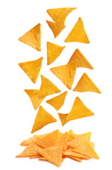 Tasty tortilla chips (nachos) falling into pile on white background