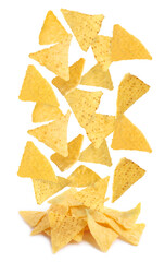 Tasty tortilla chips (nachos) falling into pile on white background