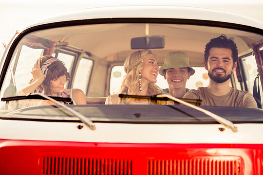 Portrait Of Group Positive Carefree People Driving Vintage Van Have Good Mood Enjoy Warm Sunny Weather