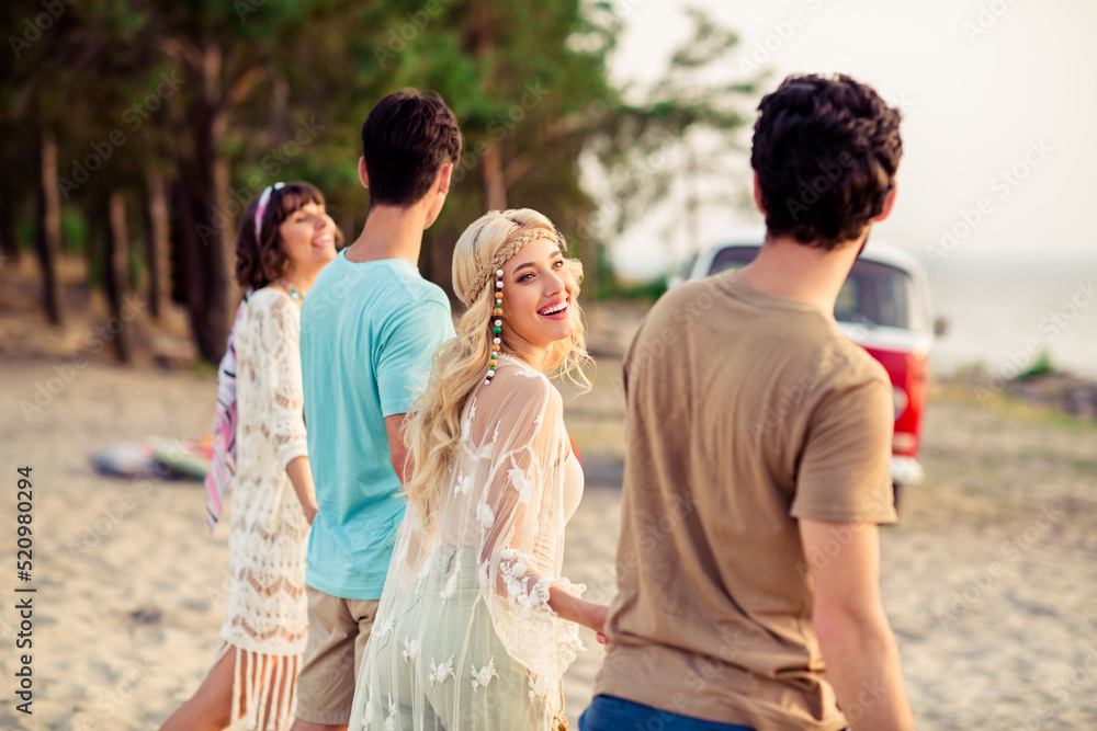 Sticker Photo of pretty cheerful buddies company walking holding hands riding retro bus smiling outdoors countryside forest