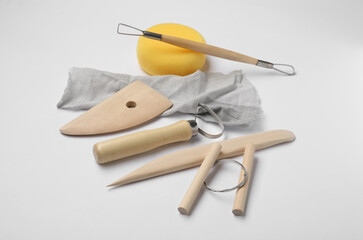 Set of clay modeling tools on white background