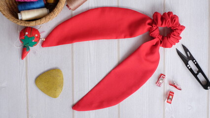 Red color bow knot scrunchies for ponytail or half up hairstyle. This elastic rubber band...