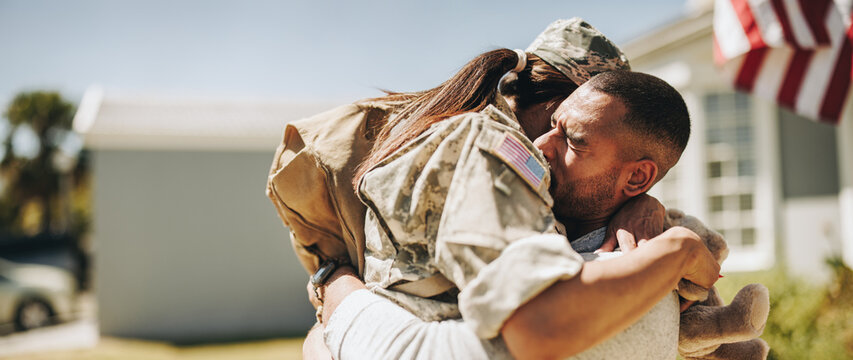 Soldier reuniting with her husband at home