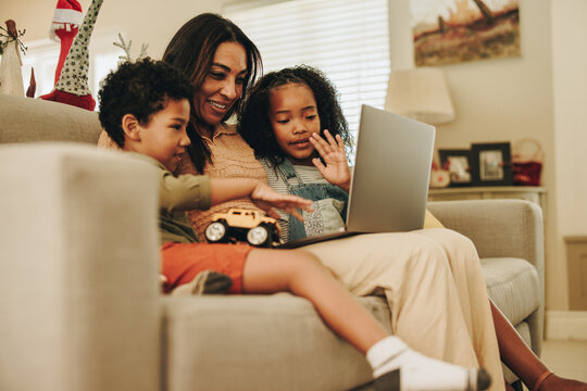 Happy Family Speaking On A Video Call At Home