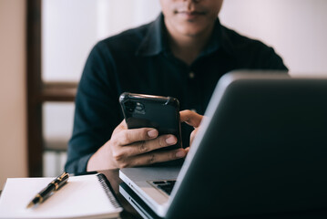 Hand using smartphone, mobile p payments online shopping, omni channel, keyboard computer.