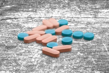 Set of pills drug on desk background
