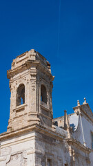 Fototapeta na wymiar detail ancient church bell tower. Monopoli, Puglia. Italy
