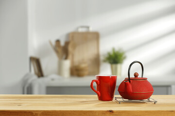 Fresh kettle with mug and kitchen interior. 