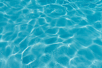 Blue rippled water in swimming pool background