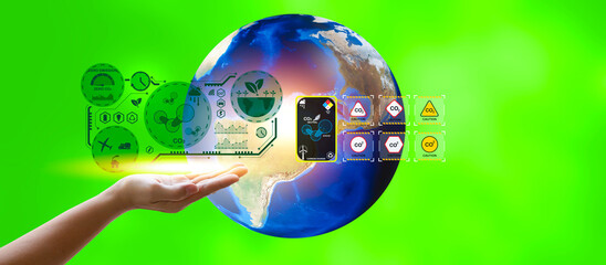 Female hand depicting a virtual diagram. Neutral target action on net zero emissions and carbon dioxide. Elements of this image are furnished by NASA. on a green background