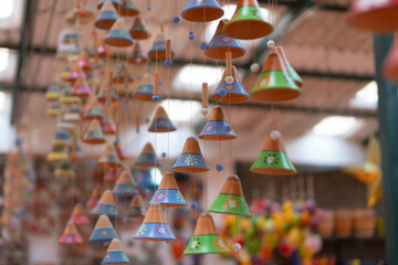 Decorative clay bells in a souvenir store. Handmade clay products. Ráquira, Colombia.