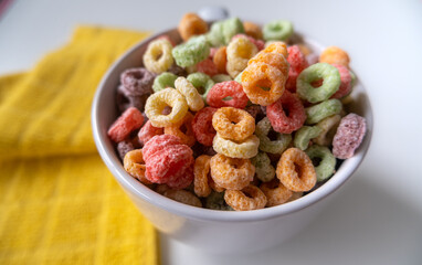 top view of Colored Breakfast Cereal in a white Bowl.