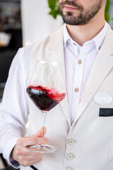 Man holding a glass of wine