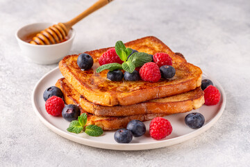 French toast with blueberries, raspberries, maple syrup