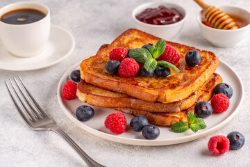 French toast with blueberries, raspberries, maple syrup