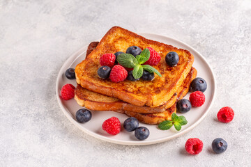 French toast with blueberries, raspberries, maple syrup