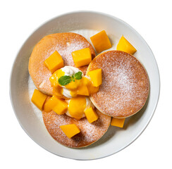 Delicious Japanese souffle pancake with dice mango and jam on white table background.