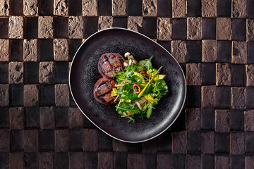 Filet mignon steak with salad