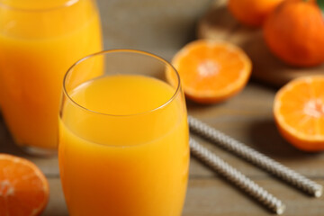 Glass of fresh tangerine juice, closeup view