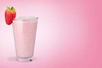 Tasty iced pink milk. Cold sweet drink mix with milk and ice in glass