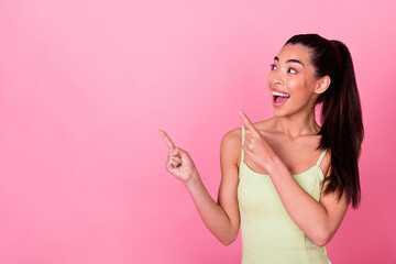 Photo of excited lady point empty space indicate wow incredible discount isolated pastel color background