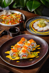 Rolls with salmon, tobiko caviar, dill, squid, avocado