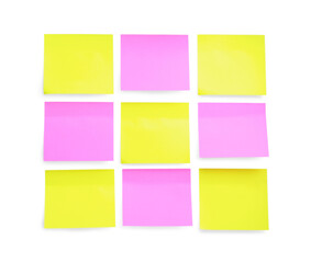 Blank yellow and pink sticky notes on white background, top view. Space for text