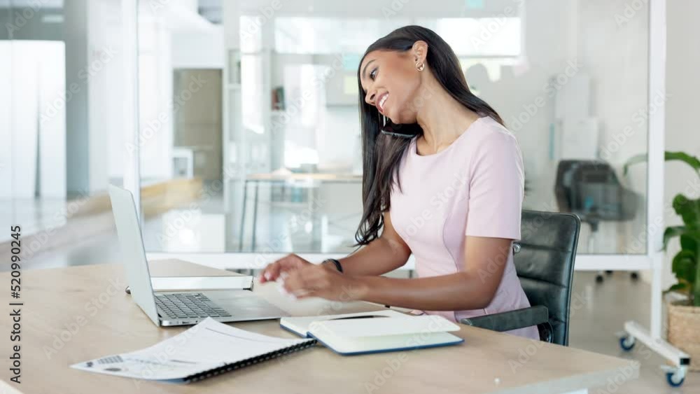 Aufkleber professional young businesswoman takes call with client as she is typing on her laptop computer in m