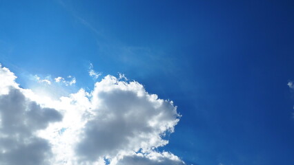 Naklejka na ściany i meble background clouds in a blue sky on a clear sunny day