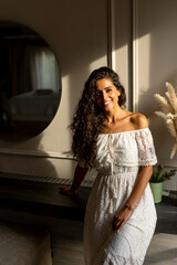 Fototapeta premium Young curly hair woman standing in the room