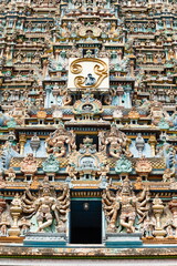 Colorful sculptures of Hindu Gods and Goddesses on the North Gopuram of Meenakshi Amman Temple, Madurai, Tamilnadu, India.