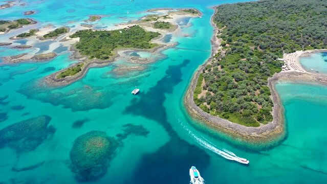 Aerial drone video of tropical exotic paradise island complex in Mediterranean sea forming a blue lagoon archipelago with crystal clear turquoise sea sandy beaches