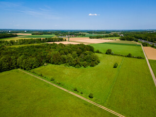 Farmland from above. Aerial view over green fields