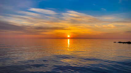 Calm sea with sunset sky In Sochi