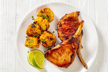 roast tomahawk pork chop with corn disks