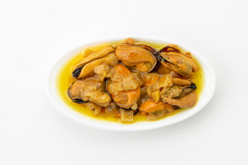 Canned mussels on ceramic tray