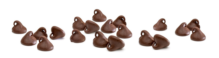 Scattered chocolate chips or morsels on white background