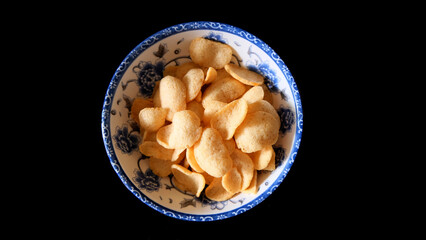 Fresh Krupuk (Prawn Crackers) on black background