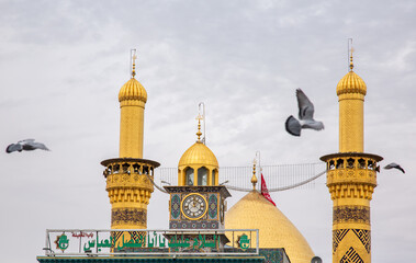 The shrine of Abbas, son of Imam Ali, peace be upon him, in Karbala, Iraq, with Imam Hussein, peace...