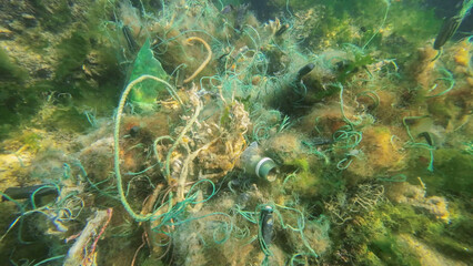 Lost fishing gear lies underwater on the seabed. Problem of ghost gear - any fishing gear that has...